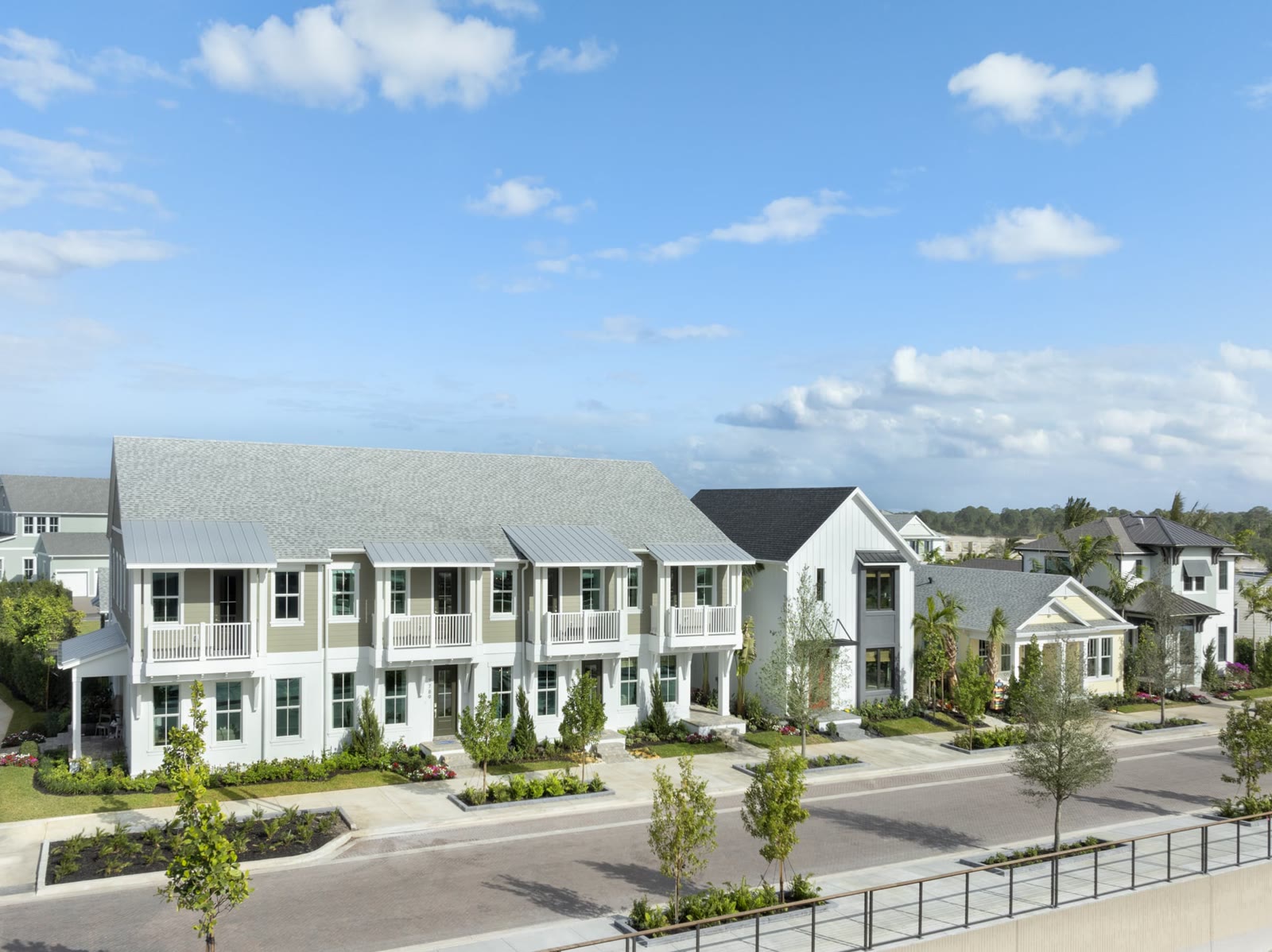 Elevated view down a Rosette Park townhome street with porches and balconies